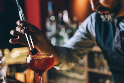 Close-up of man holding drink