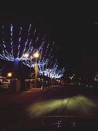 Illuminated street light at night