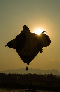 Low angle view of silhouette man against sky during sunset