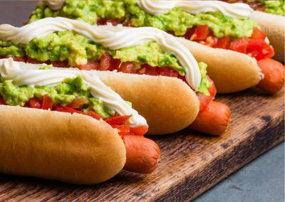 A hot dog is a food consisting of a grilled sausage served in the slit of a partially sliced bun. 