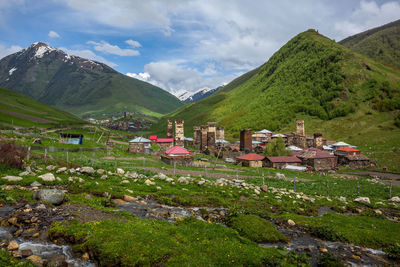 Scenic view of green mountains against sky