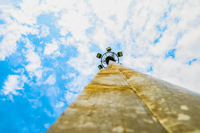 Low angle view of crane against sky