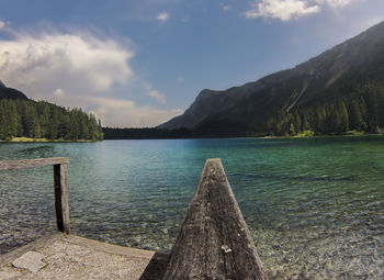 Scenic view of lake and mountains against sky