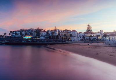 Magenta sunset overlooking the bay and historic centre of cascais, portugal