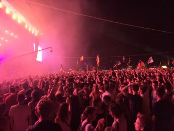 People enjoying music concert at night