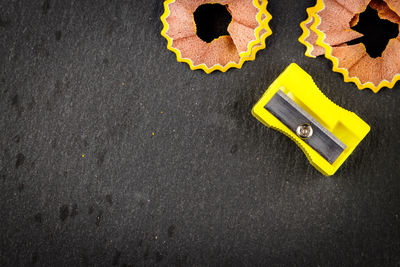 High angle view of yellow shoes on road