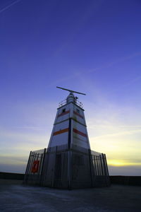 Low angle view of building against sky during sunset