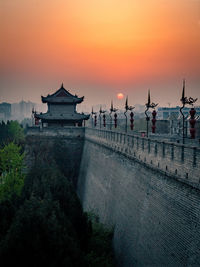 View of temple against sky during sunset