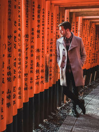 Full length of young man standing in temple