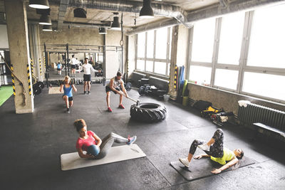 Group of young people exercising in gym