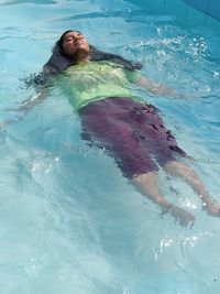 Woman swimming in pool