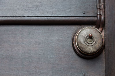 Close-up of antique light switch on wall