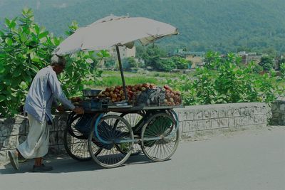 Rear view of woman having food