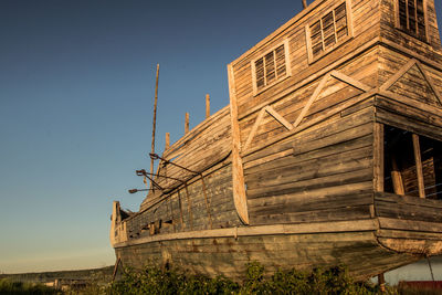 An old vikings boat staying on grass. russia, karelia. high quality photo