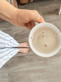 High angle view of coffee cup on table