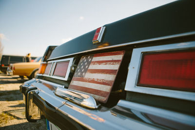 Close-up of car against sky
