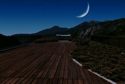 View of landscape against clear sky at night