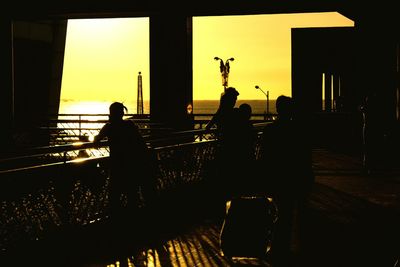 Silhouette of woman at sunset