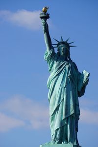 Low angle view of statue against sky