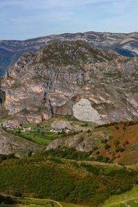 Scenic view of landscape and mountains against sky