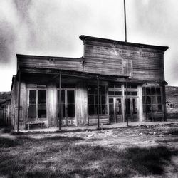 Abandoned barn on field