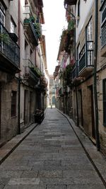 Narrow alley amidst residential buildings