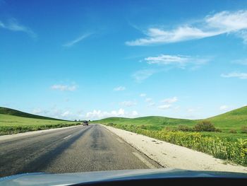 Road seen through car windshield