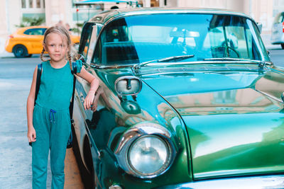 Woman standing in car