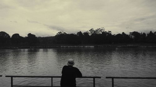 People standing on lakeshore