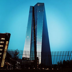 Low angle view of modern buildings against clear sky