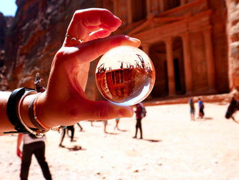 A lensball photo of the treasury , petra, jordan