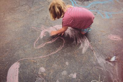 High angle view of girl making face