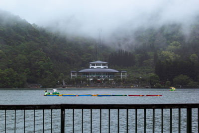 Scenic view of sun moon lake with fog