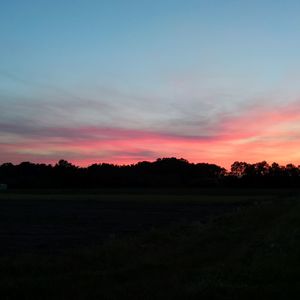 Scenic view of silhouette landscape against sky during sunset