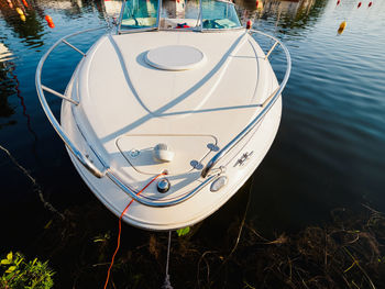 View from top on moored motorboat bow on a lake