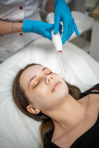 Close-up of doctor examining patient at clinic