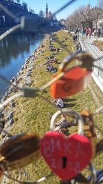 Padlocks on bridge over river