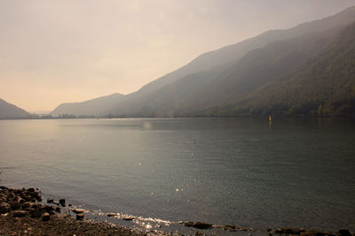 Scenic view of lake against sky during sunset