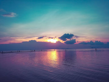 Scenic view of sea against sky at sunset