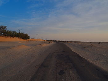 Scenic view of land road against sky