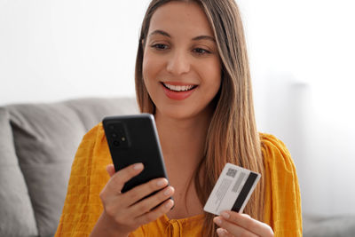 Young woman using mobile phone