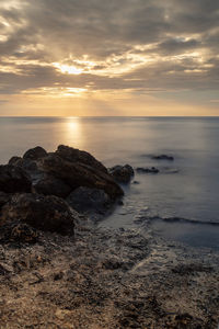 Scenic view of sea against sky during sunset