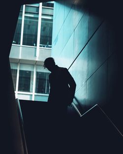 Silhouette man standing in building