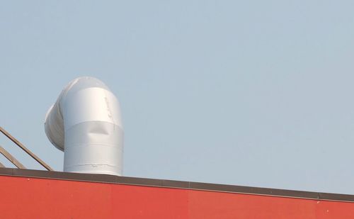 Low angle view of factory against clear sky