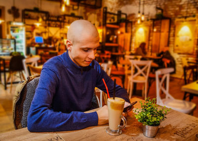 Man sitting at restaurant table
