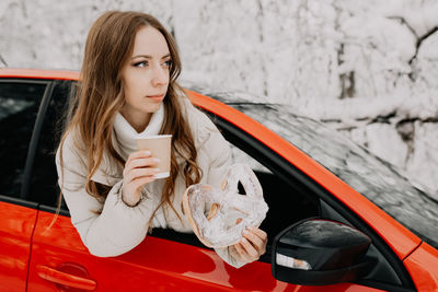 Portrait of young woman using mobile phone