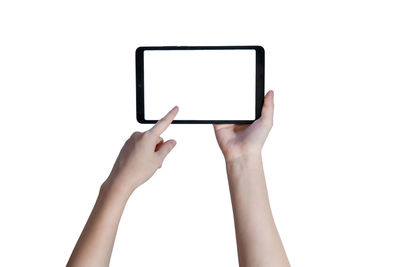 Low angle view of person using smart phone against white background