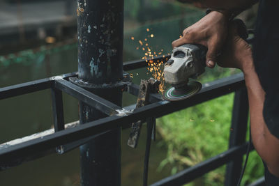 Man working on railing