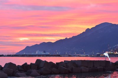 Scenic view of sea against orange sky