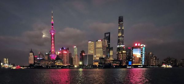 Illuminated buildings in city at night